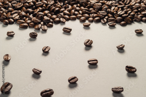 Coffebeans on Neutral Gray Background. Dark Roast Coffee.