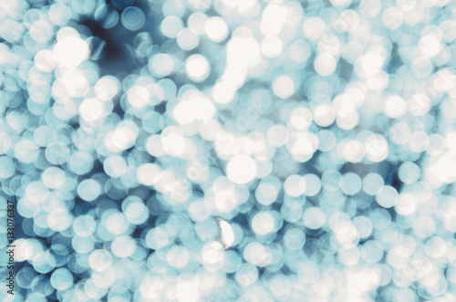 Decorative christmas background with bokeh lights and snowflakes