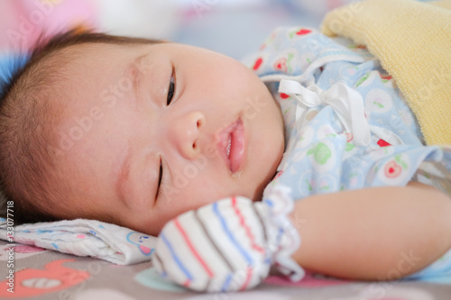 Newborn Asian baby girl sleeping