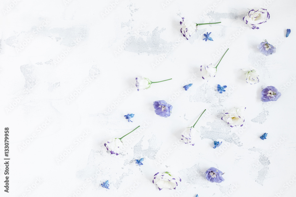Obraz premium Floral composition with lilac and white flowers. Flat lay, top view