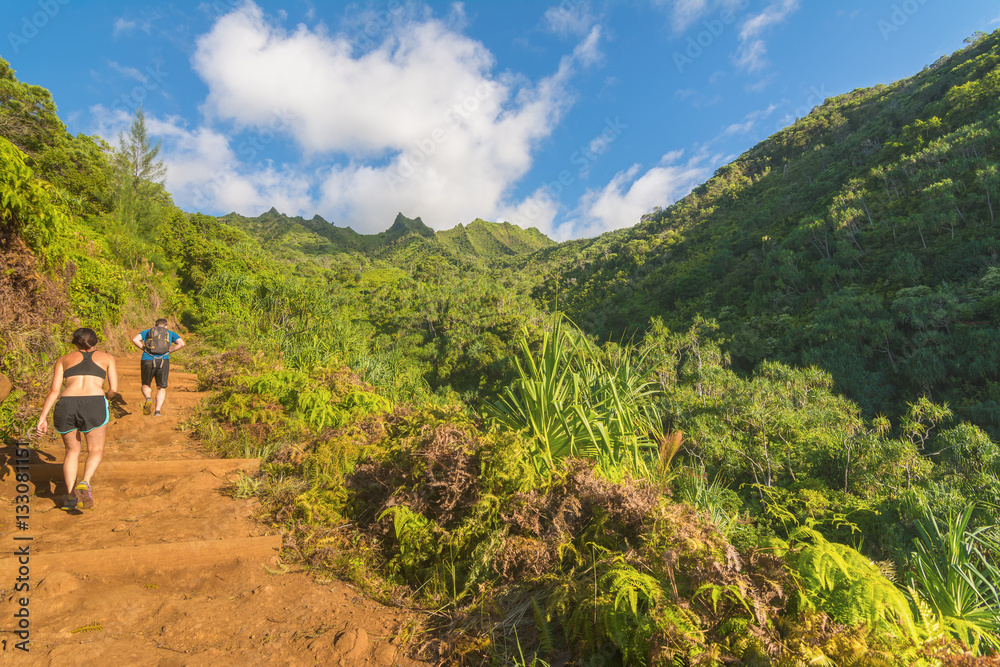 Hikers in Kalalau trail, Kauai Island, Hawaii