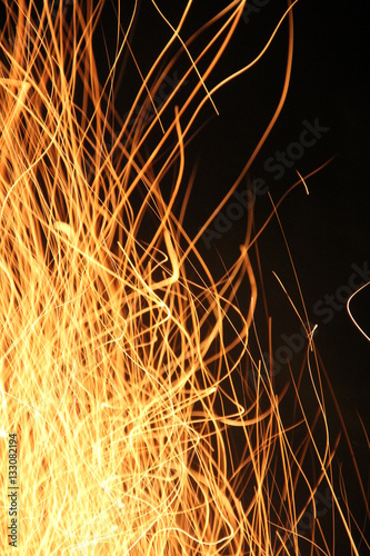 Sparks from the fire at night.