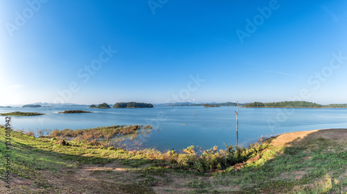 Panorama of lake and clear blue sky in summer.