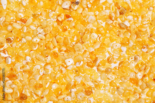 Yellow amber stones on a white background.