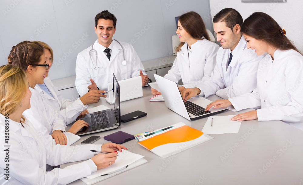 Fototapeta premium Health-care workers and head physician at colloquium in clinic