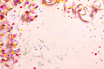 Delicate pink party background with streamers