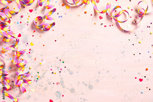 Delicate pink party background with streamers