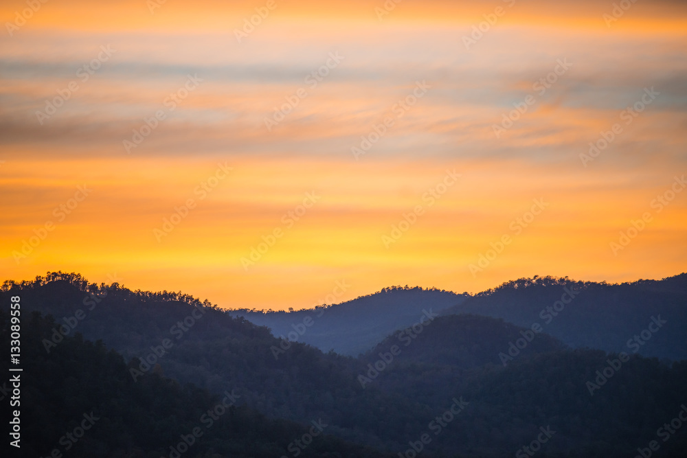 Mountaian view and orange sky in twilight time