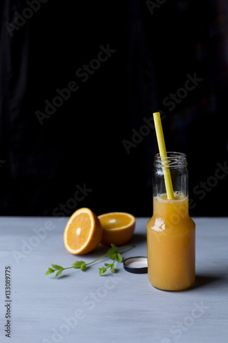 Fresh orange juice in a glass bottle