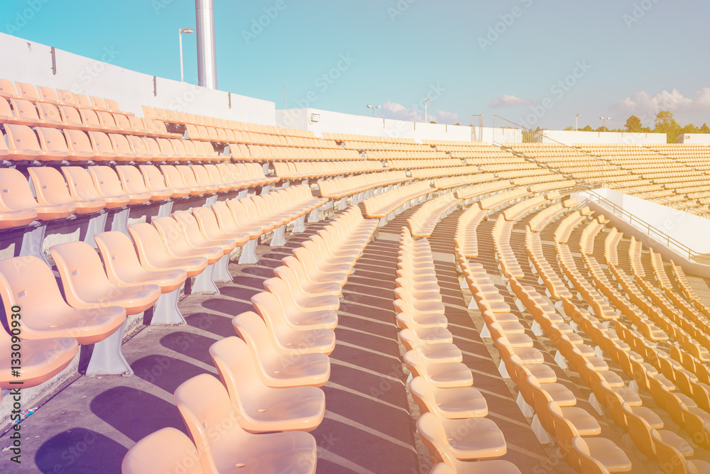 Fototapeta premium Empty seats at soccer stadium , vintage