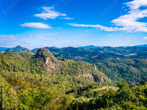 Beautiful View of Green Mountain in Deep Forest with Blue Sky