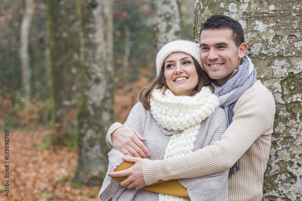 Fototapeta premium Young couple Walking Winter Woodland