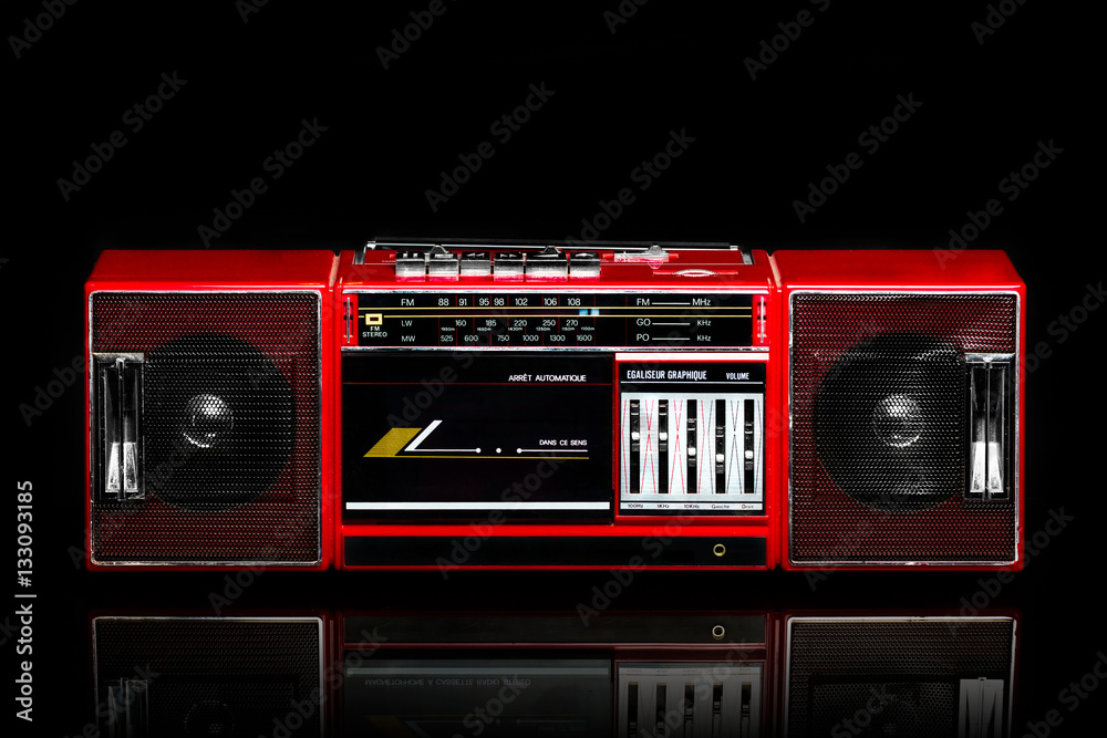 Fototapeta premium Retro red boom box on black background