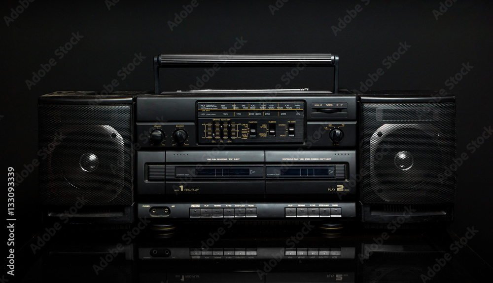 Vintage boom box on black background