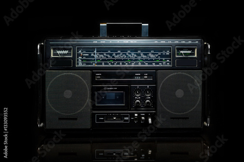 Vintage boom box on black background