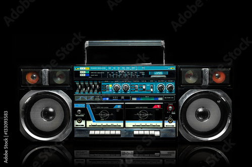 Vintage boom box on black background