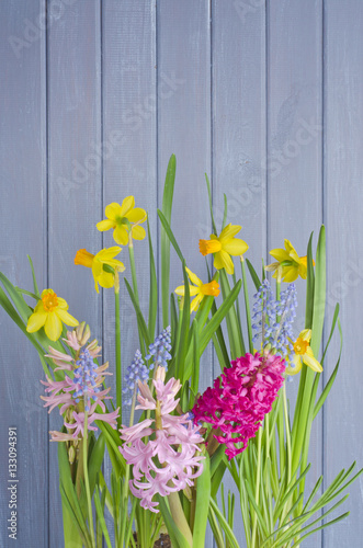 Fototapeta Naklejka Na Ścianę i Meble -  Colorful flowers on the handmade wooden background