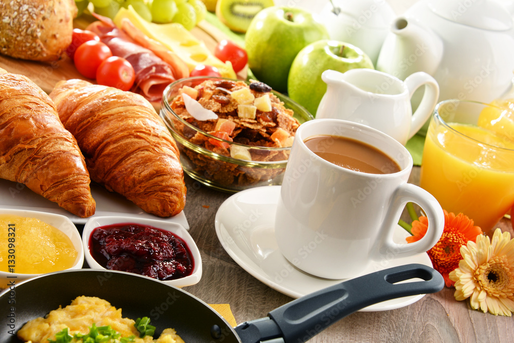 Breakfast served with coffee, juice, egg, and rolls Breakfast served with coffee, juice, egg, and rolls
