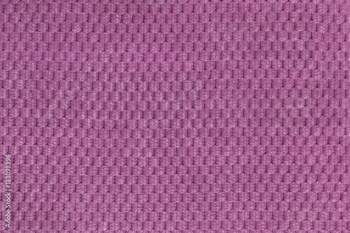 Purple background from soft fleecy fabric closeup. Texture of textile macro