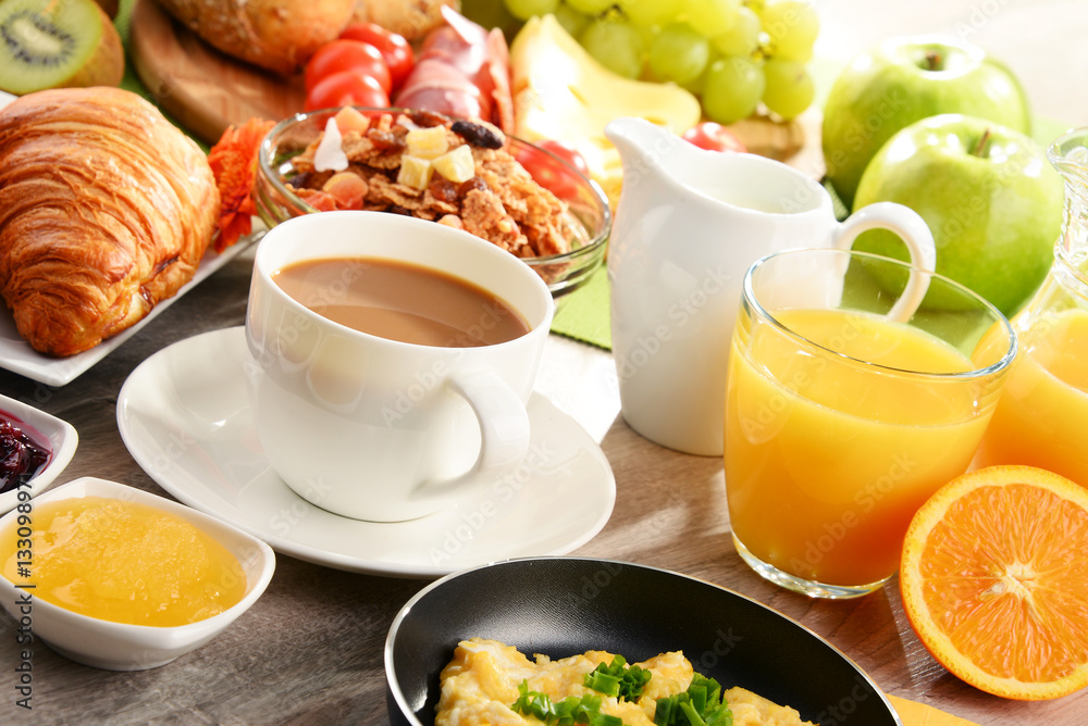 Breakfast served with coffee, juice, egg, and rolls Breakfast served with coffee, juice, egg, and rolls