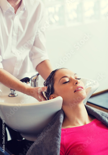 happy young woman at hair salon