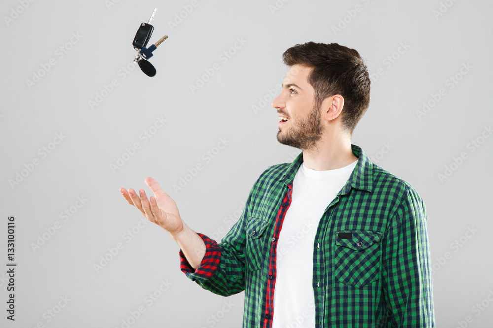 Man throwing up car keys