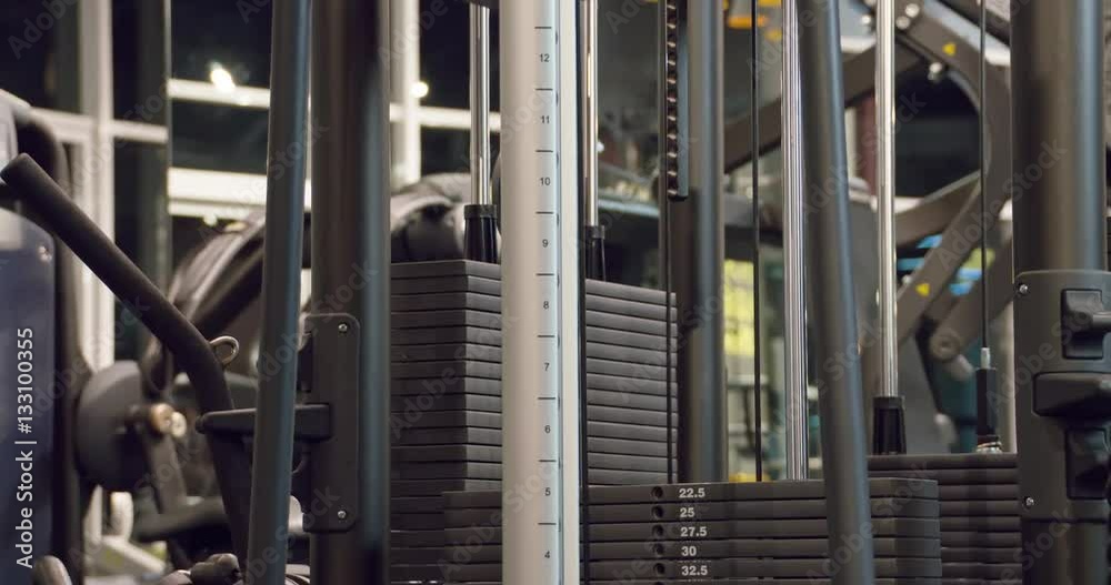 The weight stack from a cable exercise machine 4k close-up video. Gym ...
