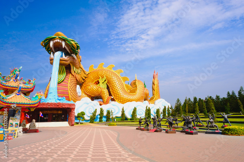 Big dragon at Dragon descendants public museum with blue sky background at  Suphanburi city, Thailand © iphotothailand