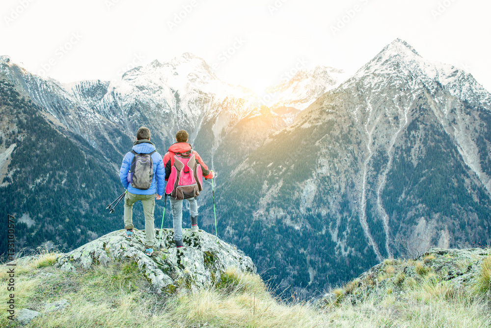 Fototapeta premium Two hiker friends at peak of the alps mountains in france