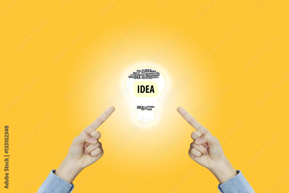 Many hands fingers pointing with index fingers to light bulb ico Many hands fingers pointing with index fingers to light bulb ico