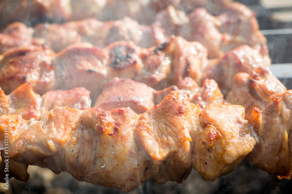 Pork shish kebab on skewers roasted on grill