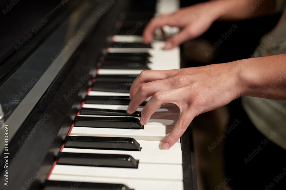 close up of hands playing piano close up of hands playing piano