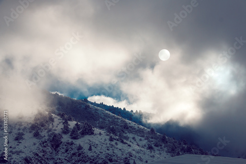 Dramatic pictersque landscape of snowy winter mountains covered photo