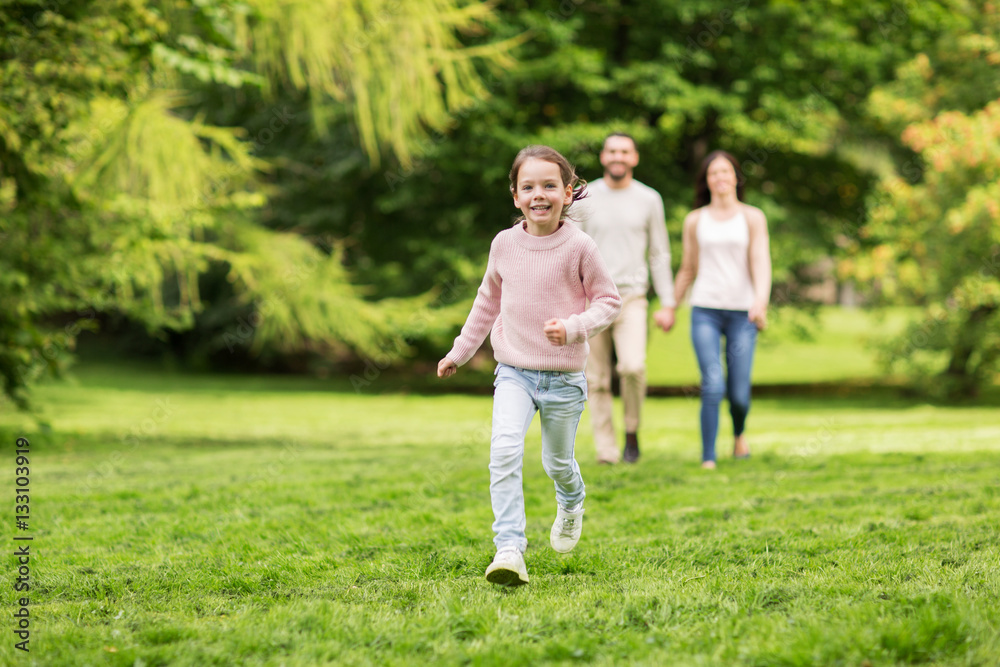 happy family walking in summer park and having fun