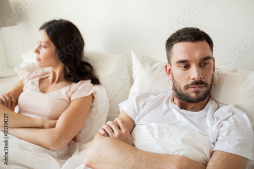 unhappy couple having conflict in bed at home © Syda Productions