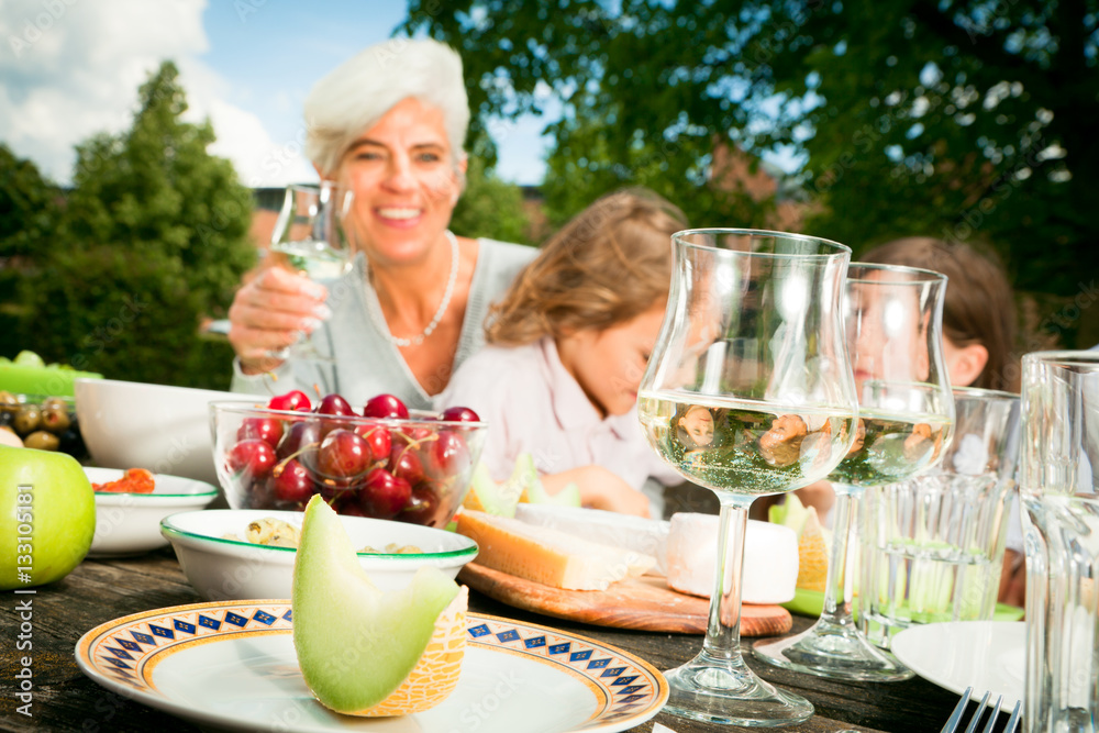 Grandmom And Their Grandchildren Are Having A Picnic Grandmom And Their Grandchildren Are Having A Picnic