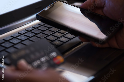 Selective focus on laptop online mobile phone payment internet b