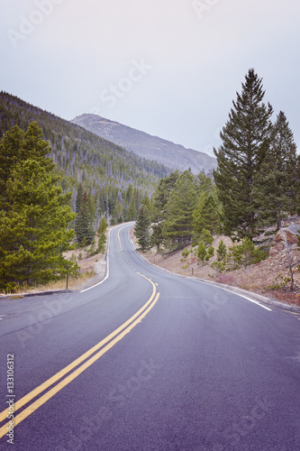 Color toned empty road in Rocky Mountains National Park, Colorado, USA.