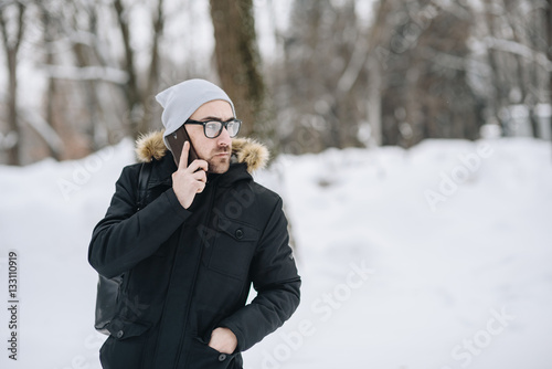 Happy young man with beard.