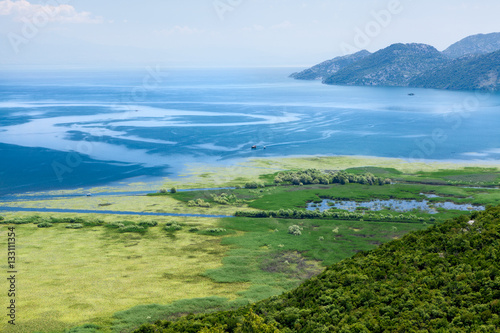 Panorama of the Skadar lake with mountains on horizon. Skadarsko jezero is a national park in Montenegro, Europe