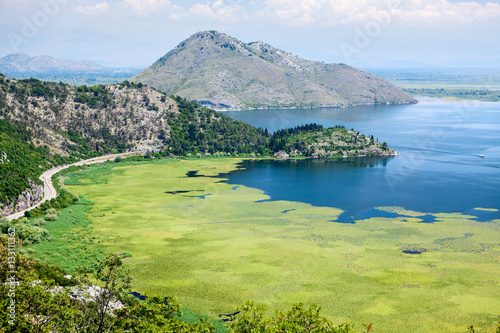 Panoramic view at the Montenegrin part of Skadar lake with highway around. Skadarsko jezero is a national park in Montenegro, Europe