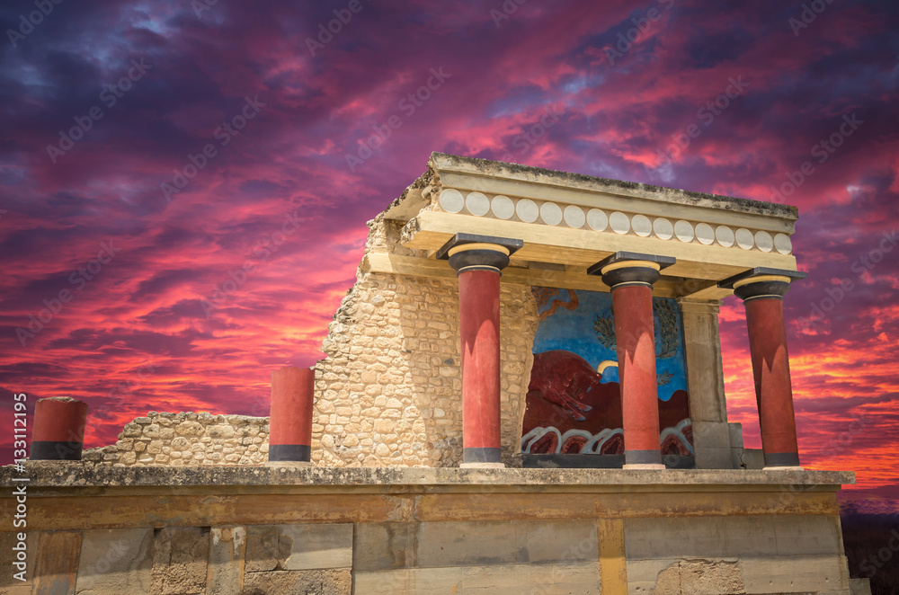 Stunning sunset over Knossos palace, Crete island, Greece. Detail of ancient ruins of famous Minoan palace of Knossos.