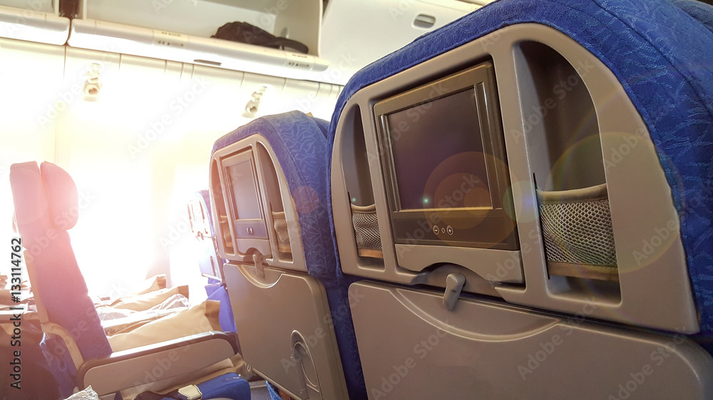 The light of the sun peeking into the window of the plane. The light of the sun peeking into the window of the plane.