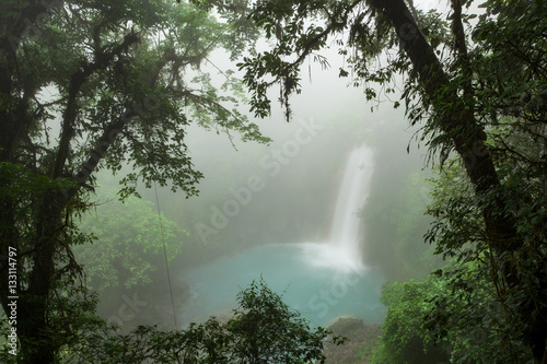 Rio celeste waterfall at foggy day