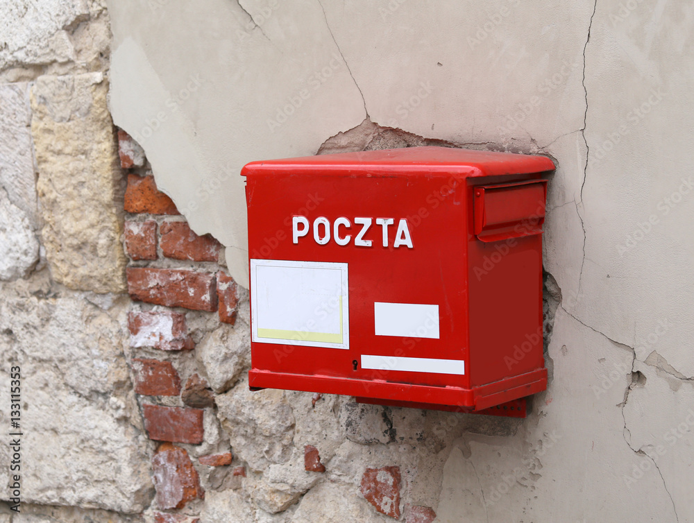 Obraz premium red mailbox with the words POLISH POSTAL service
