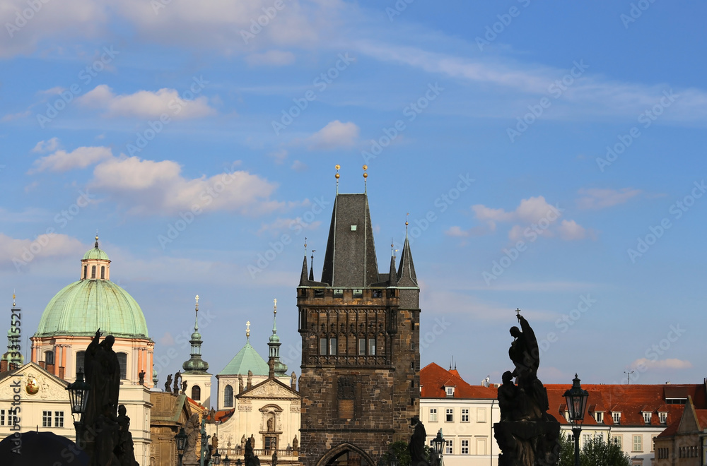 skyline of prague with the medieval tower of the Charles Bridge