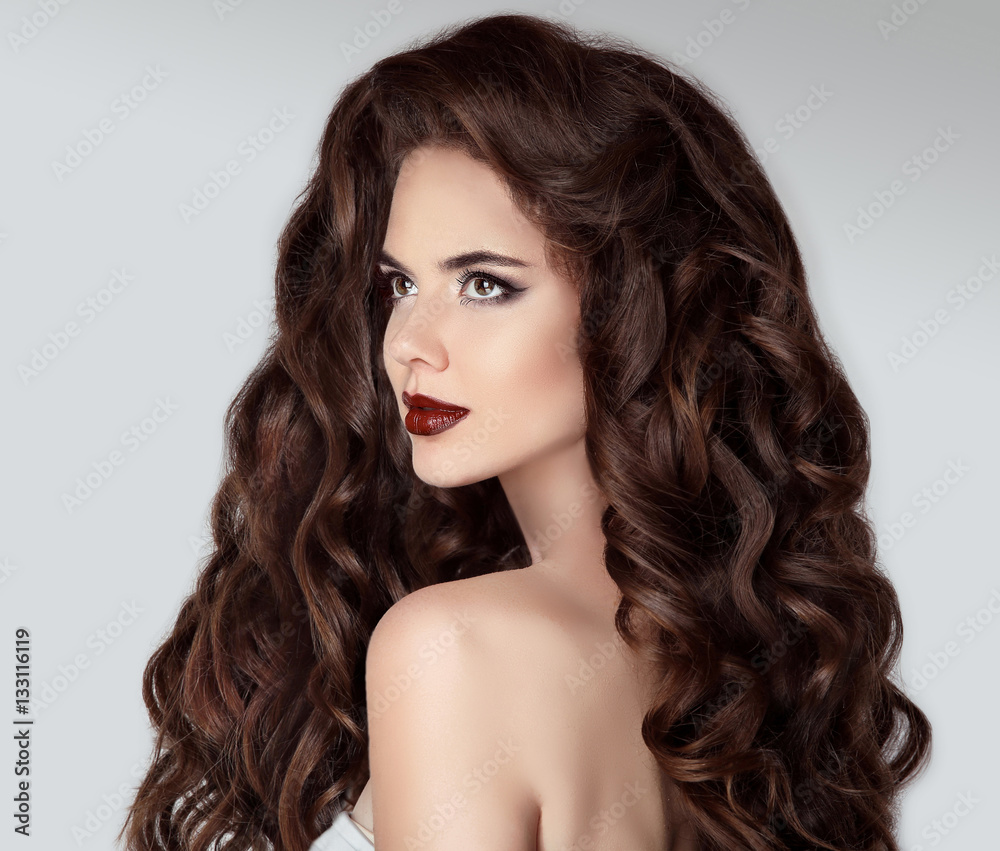 Long hair. Beautiful brunette woman portrait with wavy healthy h Long hair. Beautiful brunette woman portrait with wavy healthy h