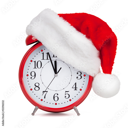 Fotografie Hat Santa Claus put on a alarm clock