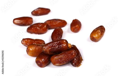 dry dates isolated on white, sweet fruit