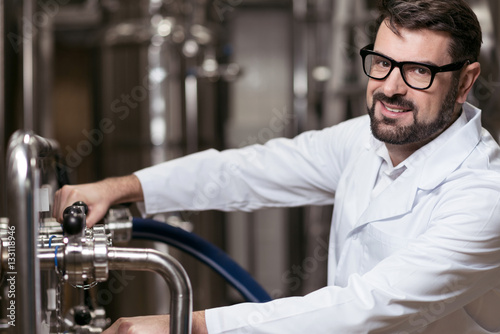 Overjoyed man posing in brewery